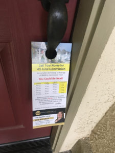 Realty One Real Estate door hanger on the door