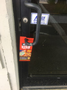 Sac Taco's door hanger on the front door.